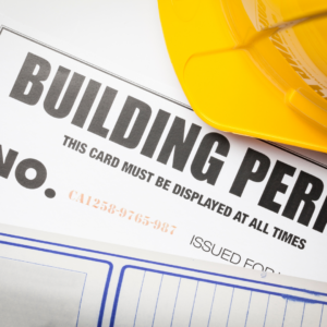 A building permit with a hard hat