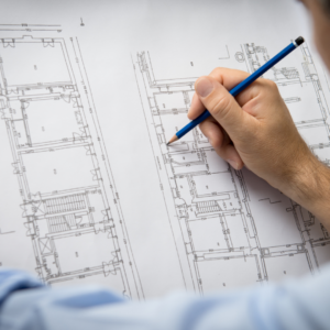 A draftsman drawing blueprints