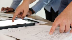 architechts looking at blueprints